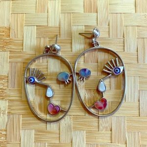 Woman’s Face Earrings.